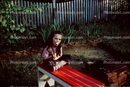 Girl eating a Marshmallow, June 1966