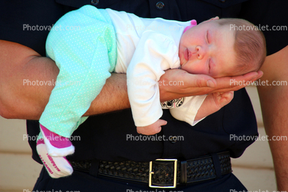 Baby Girl Sleeping on Fathers Arm