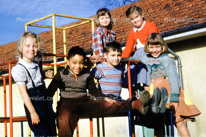 girls and boys on a junglegym, smiles, smiling, cute, 1952, 1950s
