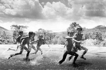 Boys running on the beach, Esteli, Nicaragua