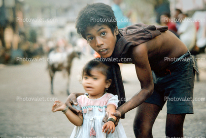 Boy helping his sister, Khroorow Baug, Mumbai Back Bay