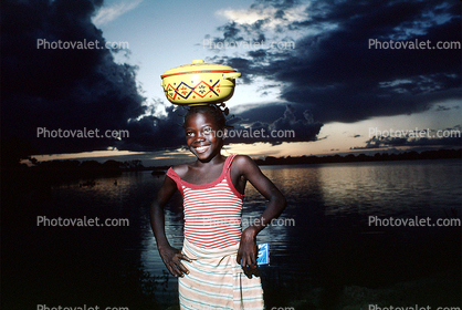 Girl, Smiles, Sunset Clouds at a Lake