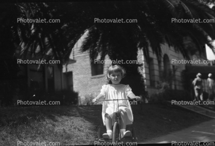 Girl riding a Tricycle, 1950s