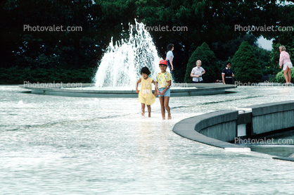 Boy and Girl Wading in Water Fountain