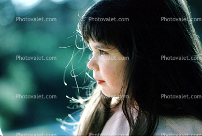 Profile of girls face, pensive