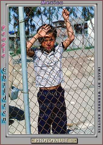 Boy behind a fence, Colonia Flores Magone