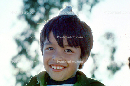 Boy with rat on his head, male, guy, rat, smiles, teeth, eyes, chin