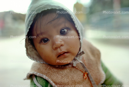 Baby staring, bittersweet contemplation of the future, hoody, Kathmandu, Nepal