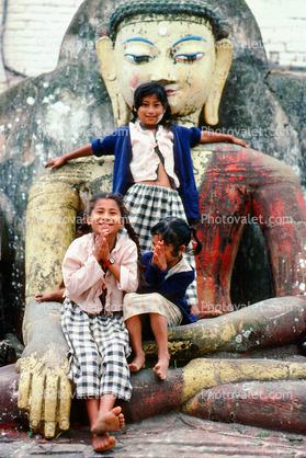 Girls with a statue of Buddha, Kathmandu, Nepal