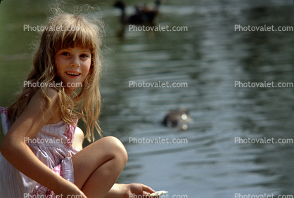 Smiling Girl feeding Ducks, 1960s