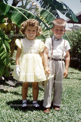 boy and girl, Lori, smiling, formal dress, bowtie, April 1962, 1960s