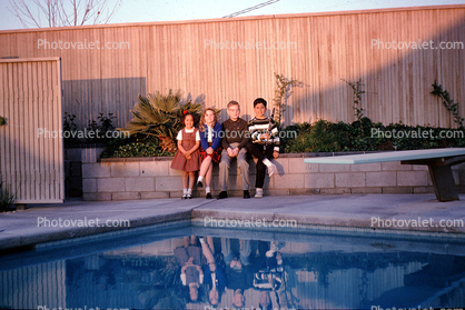 backyard, pool, diving board, sun, reflection, Girl, Boy, 1960s