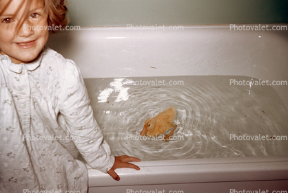 Vicky and her Duck George, swimming in the tub, cute, funny, 1950s