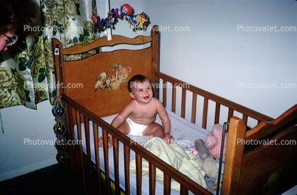 Baby Boy in a Crib Bed, smiles, cute, 1960s