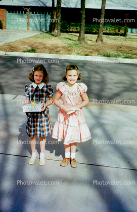 Birthday presents, girls, sidewalk, dress, smiles, smiling, 1940s