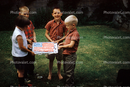 Boys, girl, Betsy Ross flag cake, backyard, July 1959, 1950s