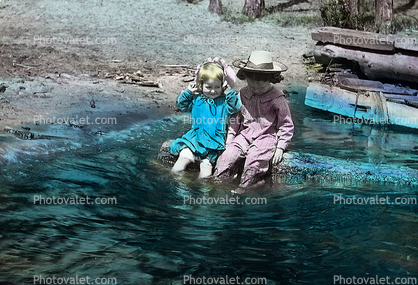 Two girls sitting by Pond, Postcard, 1910's