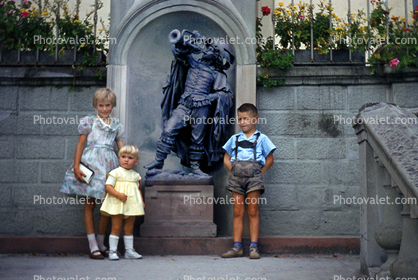 Three Siblings at The Trumpeter of Sackingen sculpture, Bad Saeckingen, Germany, 1950s