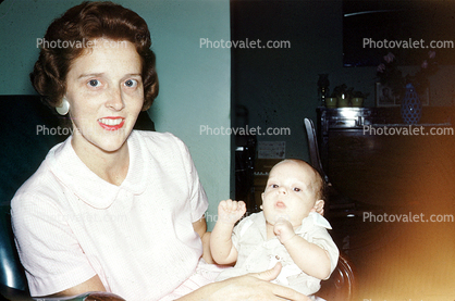 smiling mother and baby November 1960, 1960s