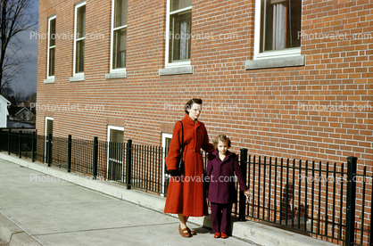 Mother with her Daughter, Brick Building, 1950s