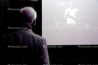 Bucky watching new documentary film "Modeling the Universe", Cooper-Hewitt National Museum of Design, New York City