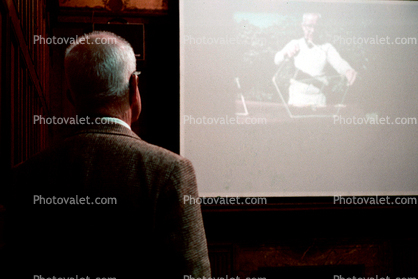 Bucky watching new documentary film "Modeling the Universe", Cooper-Hewitt National Museum of Design, New York City