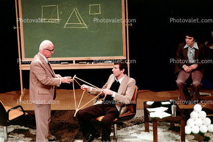 Tetrahedron, polyhedra, stage, chalkboard "Conversations with Buckminster Fuller" event, New York City
