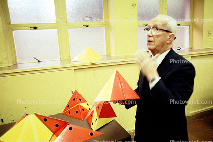 Bucky preparing polyhedra models, Tetrahedron, "Conversations with Buckminster Fuller" event, Oakland, Polyhedra