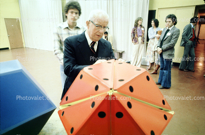 Icosahedron, Bucky preparing polyhedra models, "Conversations with Buckminster Fuller" event, Oakland, Polyhedra