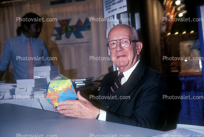 Bucky holding the Dymaxion Map Globe, polyhedra, Icosahedron, book signing