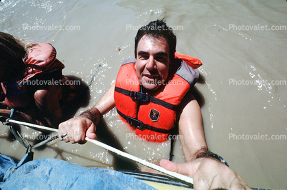 Max the Lawyer floats in the muddy river, Colorado River, raft trip