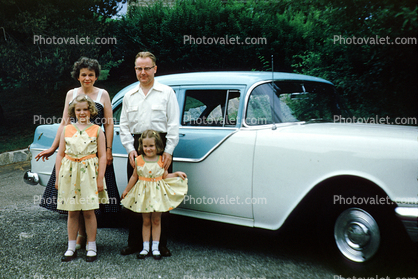 Mother, Father, Daughters, Oldsmobile Car, dresses, vehicle, automobile, 1950s