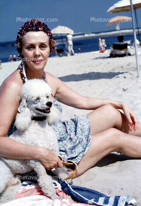 lady and her poodle, July 1954, 1950s