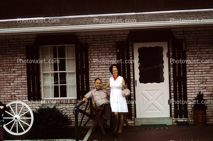 Lady with a Purse, man, smiles, door, home, house, July 1973, 1970s