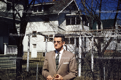 Man, Houses, Suburbia, glasses, suit and tie, 1940s