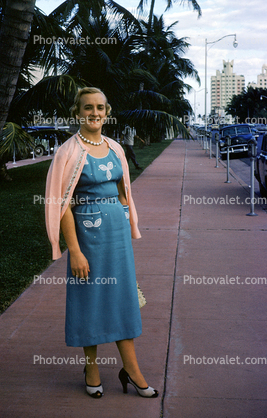 Woman, Sweater, dress, sidewalk, 1950s