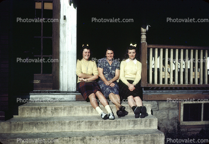 Women Sitting on the Front Porch, steps, hair ribbons, 1940s