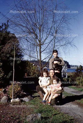 Father with Daughters and son, dog, 1950s