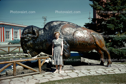 Woman in front of a Buffalo Statue, bull, Motel, 1950s