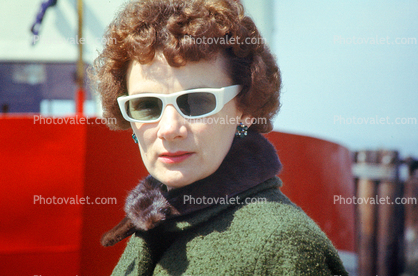 Woman in Sun Glasses, coat, 1960s