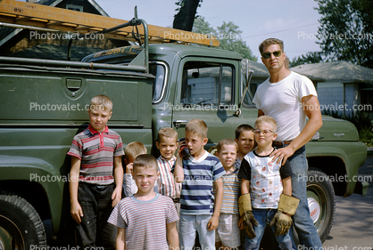 Man with the neighborhood kids, boys, telephone truck, serviceman, t-shirt, 1950s