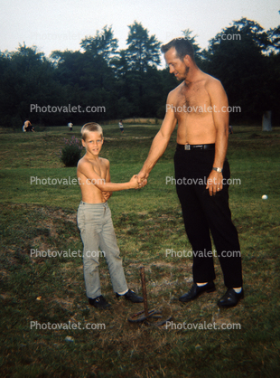 Father and Son shaking hands, 1960s