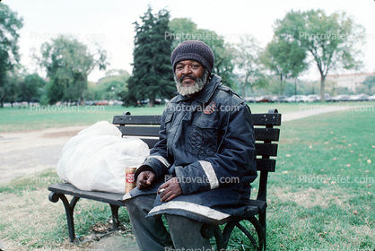Homeless Man Sitting on a Bench