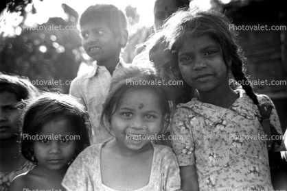 Girls, smiles, pigtails, nosering, slum, Mumbai, India