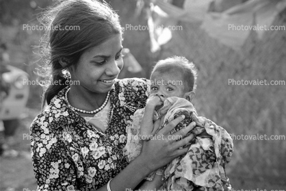 Teen mother with son, slum, Mumbai, India