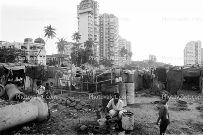 Mother Cooking Food, Shanty Homes, apartment buildings, slum, Mumbai, India