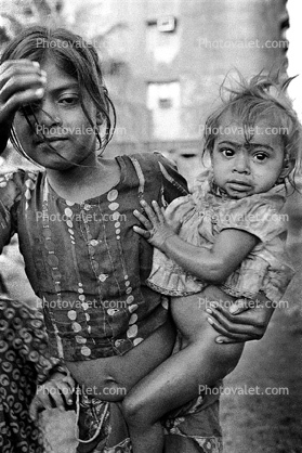 Sisters, baby, girl, slums, shacks, shanty town, Mumbai, India