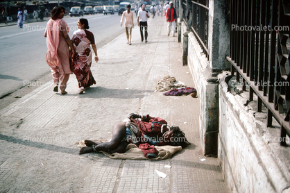 Woman lying in Pain, Crying, suffering, dying, Mumbai, India