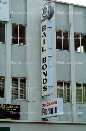 Bail bond, signs, signage, cars, building