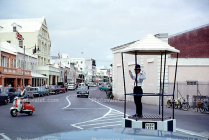 Traffic Cop, Bobby, Vespa Motorscooter, cars, road, shops, building, Hamilton, 1950s
